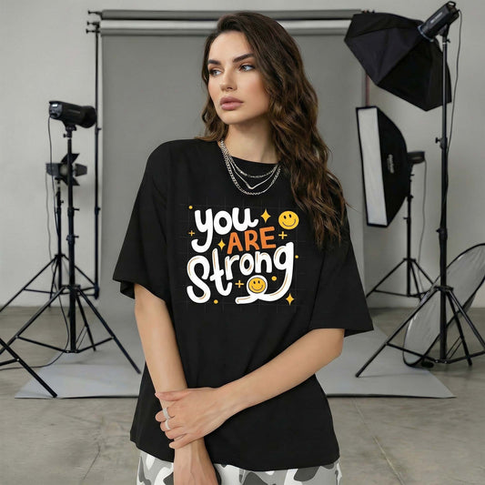 Women Black Oversized Graphic T-Shirt – “You Are Strong” Motivational Typography Print | Premium Cotton Tee